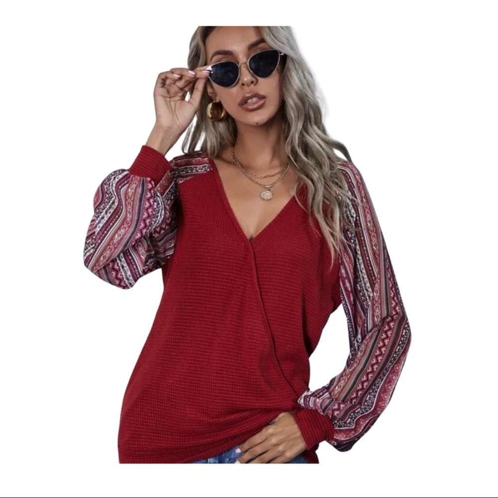 Woman’s V-neck pullover burgundy shirt.